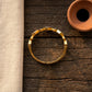 Gold Plated Artificial Stones Studded Anti-Tarnish Enamelled Cuff Bracelet