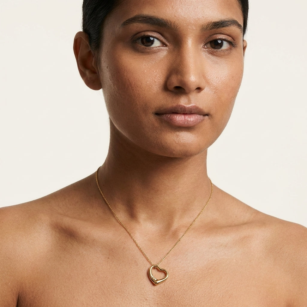 Elegant Gold Heart Pendant Necklace With Diamond Design