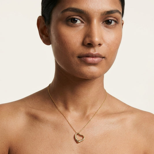 Elegant Gold Heart Pendant Necklace With Diamond Design